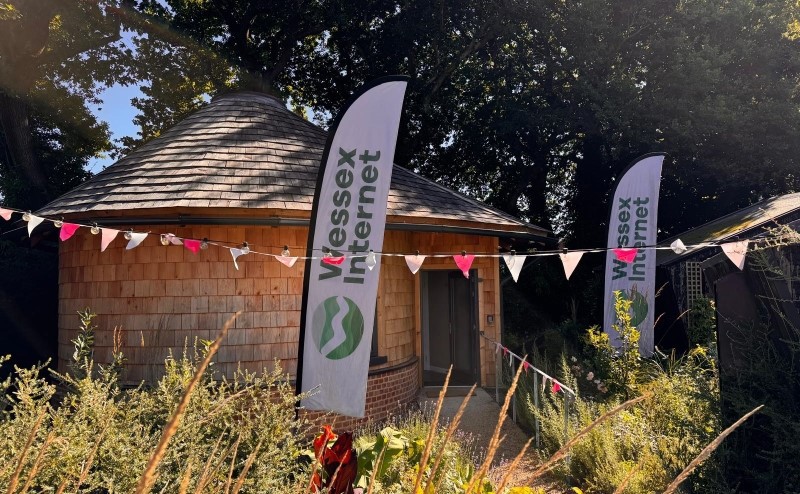 Wessex Internet branded flags in front of building.