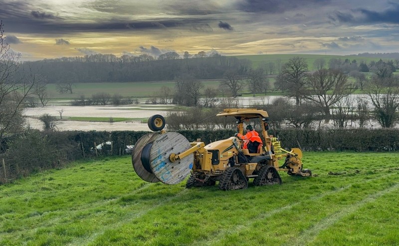 Midi mole plough in field