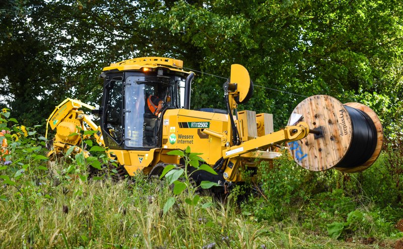 Mighty mole plough amongst long grass