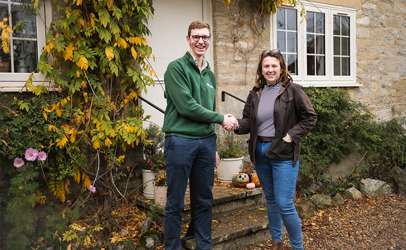 Ed Carter and Zoe Hallett shaking hands