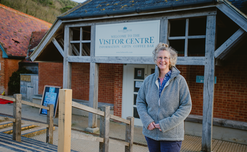 Woman in front of Lulworth Visitor Centre