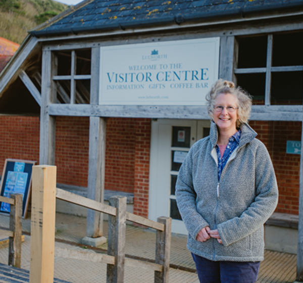 Woman in front of Lulworth Visitor Centre