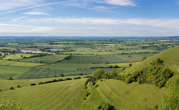 Landscape view of Wiltshire with hills and a lake