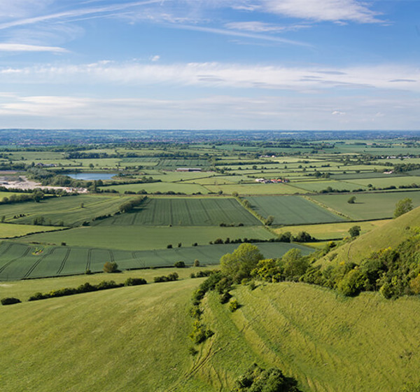 Landscape view of Wiltshire with hills and a lake