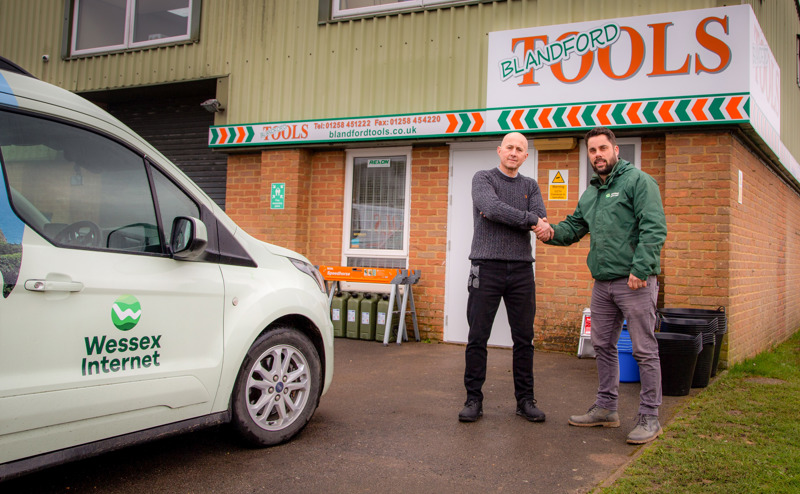 Two people outside Blandford Tools