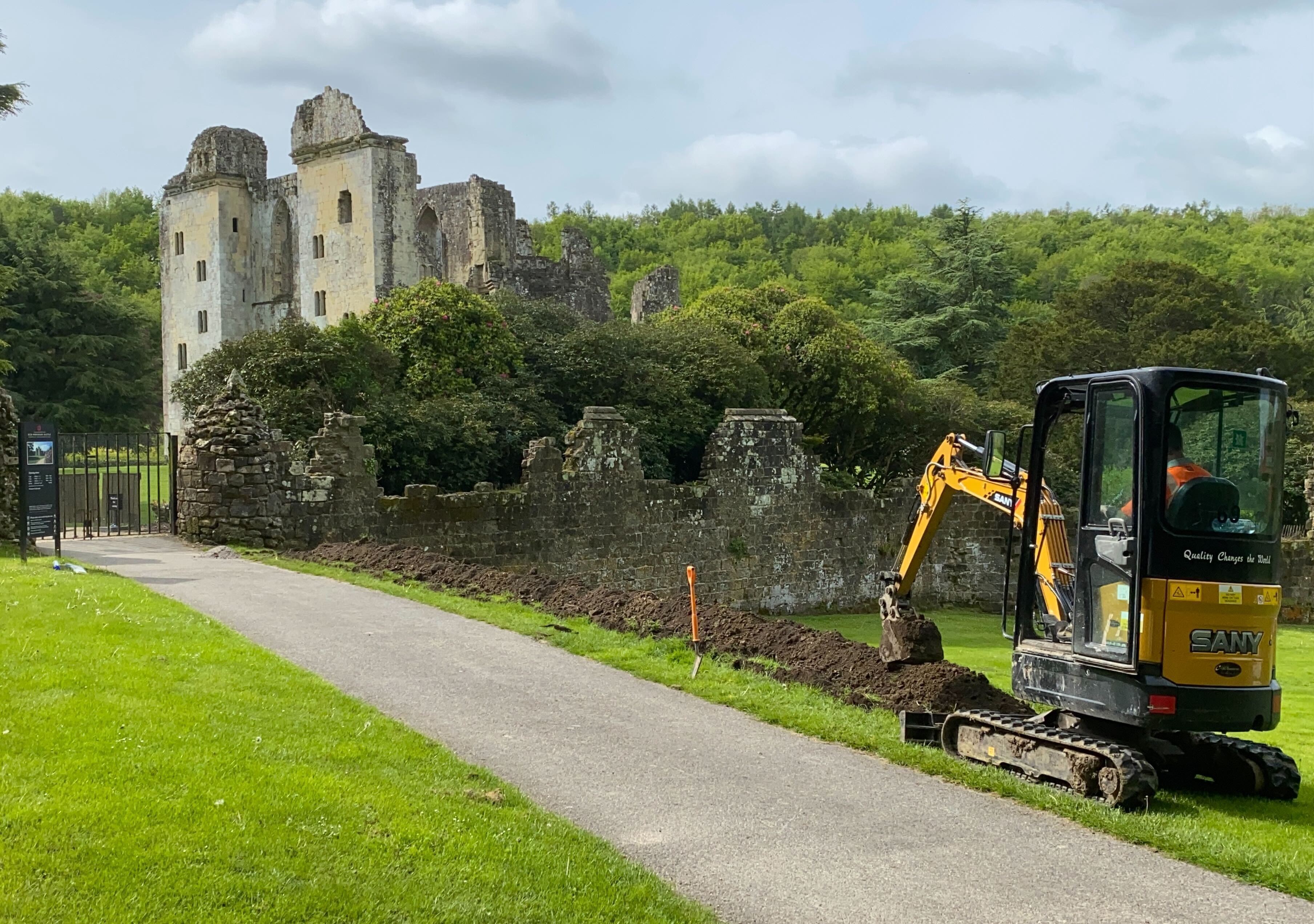 Old Wardour Castle in the background with digger to the right