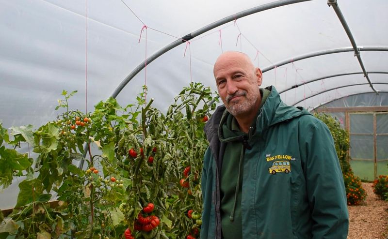 Paul Williams in front of tomato plants