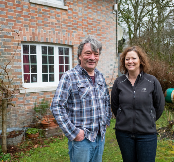 Gary And Morag Warr in front of property