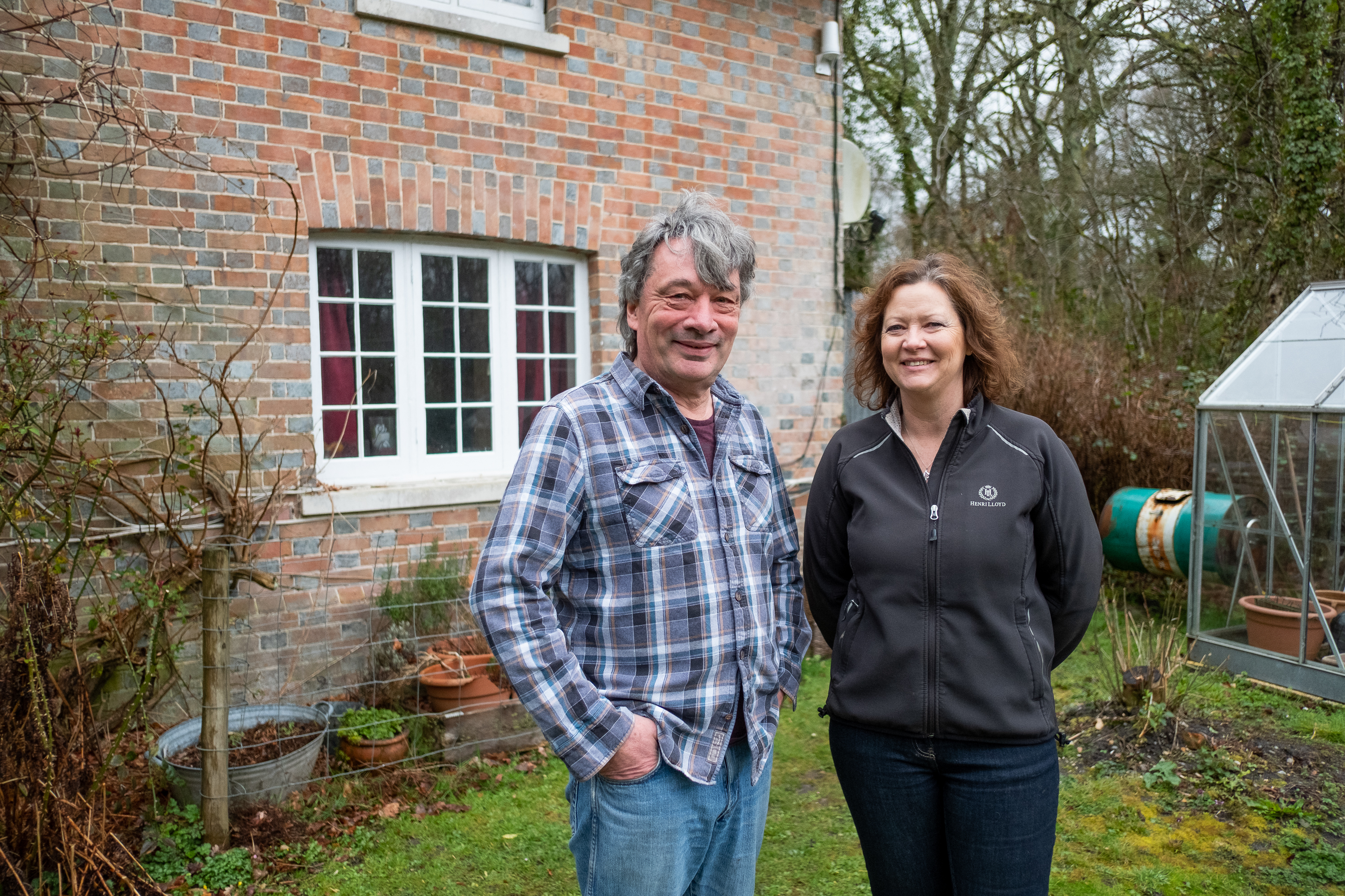 Gary And Morag Warr in front of property